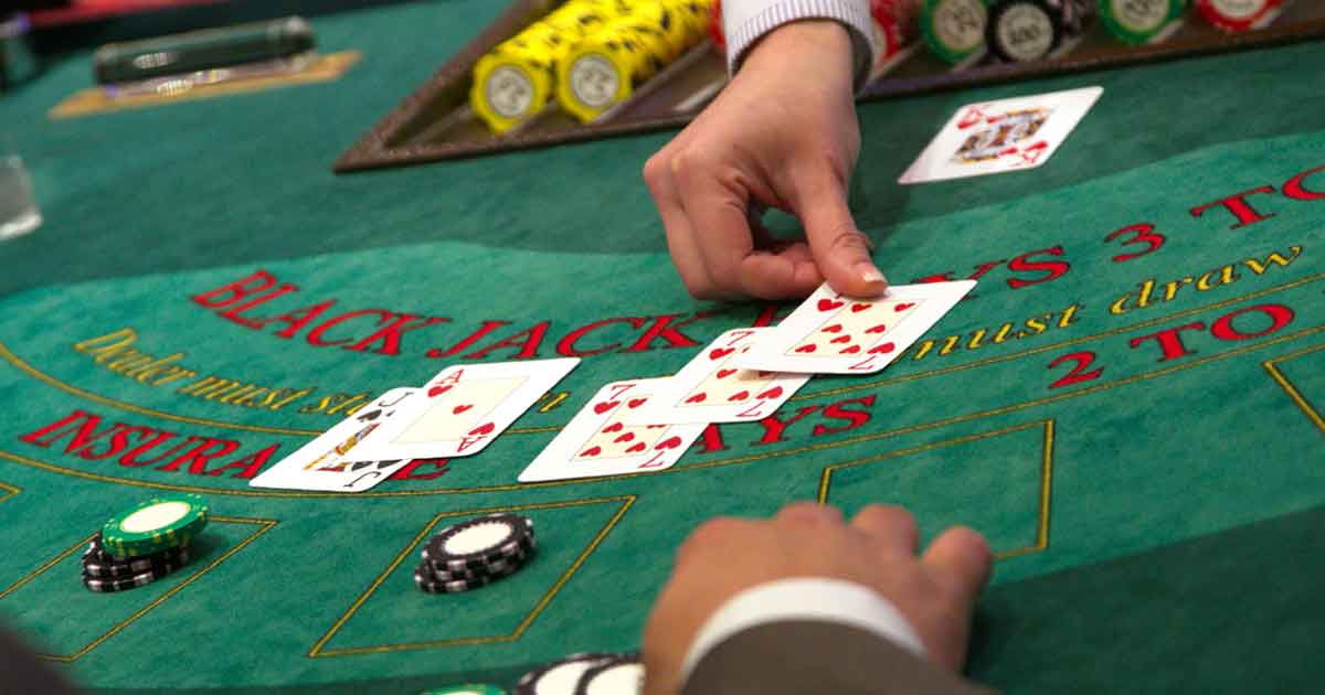 Professional blackjack dealer dealing cards at a casino night event