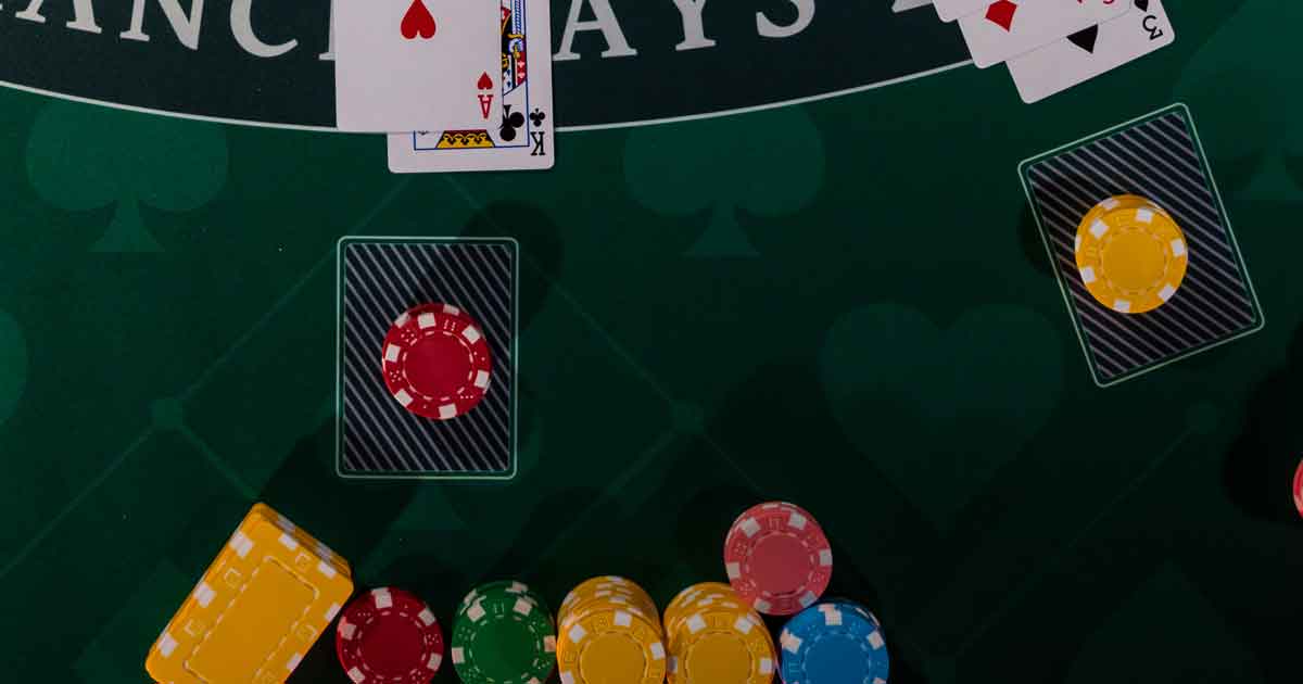 Guests playing blackjack at a casino party rental event