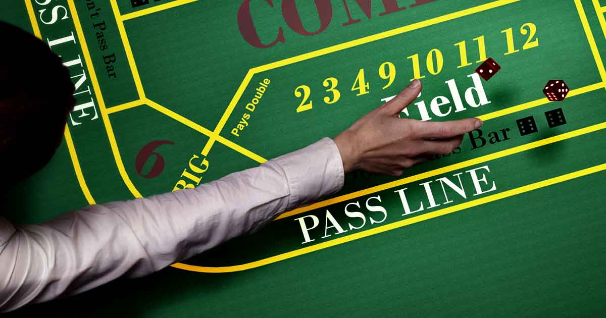 Craps dealer working the table at a casino rental event