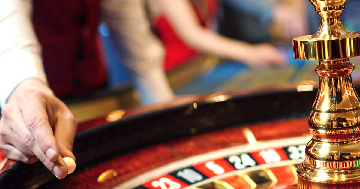 Roulette ball dropping into a pocket at a casino rental table